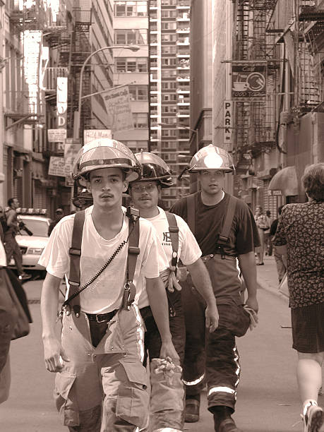 Volunteers Firefighter heads into ground zero. New York City, NY, USA - September 16, 2001: Volunteers firefighter heads into ground zero. On Nassau and Fulton. 2 blocks from tower #5. september 11 2001 attacks stock pictures, royalty-free photos & images