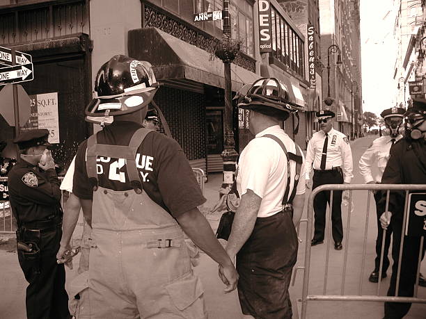 Volunteers Firefighter heads into ground zero. New York City, NY, USA - September 16, 2001: Volunteers firefighter heads into ground zero. On Nassau and Fulton. 2 blocks from tower #5. 911 new york stock pictures, royalty-free photos & images