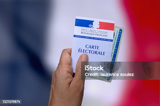 istock vote with your electoral card and identity card 1321519874