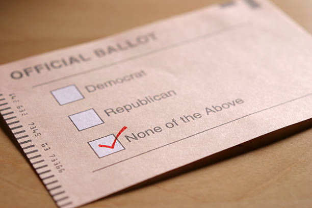 Voting Independent A ballot offering Democrat, Republican, or None of the Above, with the latter selected. Shallow depth-of-field with focus on checkmark. voting ballot photos stock pictures, royalty-free photos & images