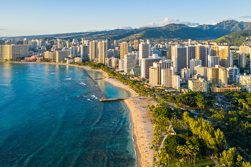 The beach, hotels, office towers and commercial buildings in Honolulu Hawaii.
