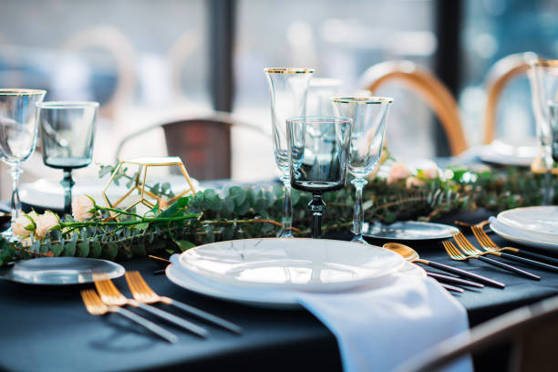 Waiting for the guest,table elegance set Black and gold color Elegant table set for Wedding celebration reception in barn or luxury dinner party arranging stock pictures, royalty-free photos & images