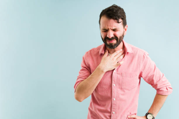 Waiting for the reflux medicine to work stock photo