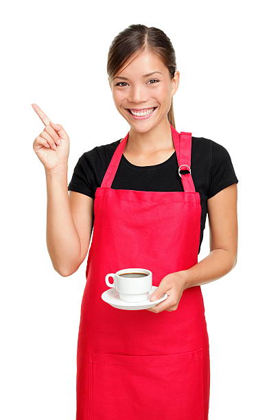Waitress pointing holding coffee stock photo