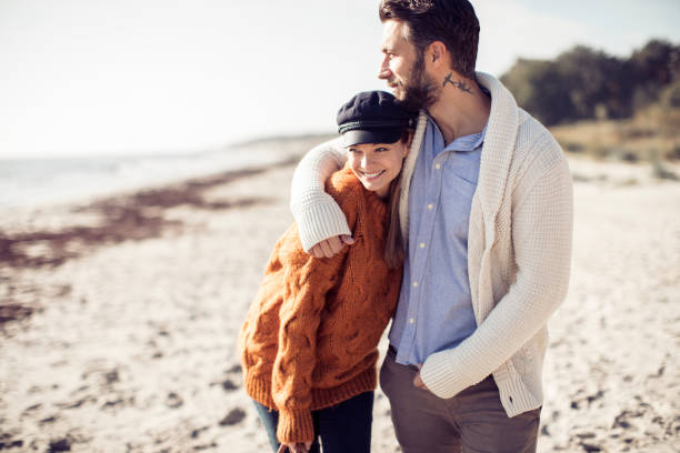 Walk by the Beach Close up of a young couple enjoying time on the beach beautiful swedish women stock pictures, royalty-free photos & images
