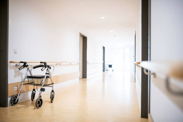 Walking frame in the corridor, Germany Germany: Walking frame in the corridor of a nursing home. elderly care stock pictures, royalty-free photos & images