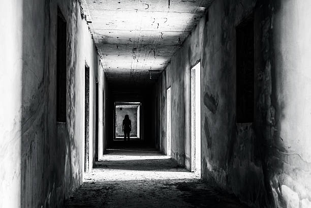 walkway in abandoned building with scary woman inside walkway in Abandoned building with scary woman inside, darkness horror and halloween background concept art photos stock pictures, royalty-free photos & images