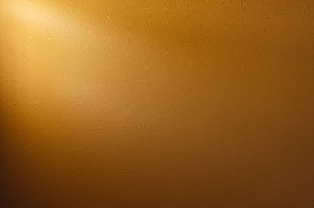 Wall Background Coffee Brown colored wall background. Light source from window on top left. brown background stock pictures, royalty-free photos & images