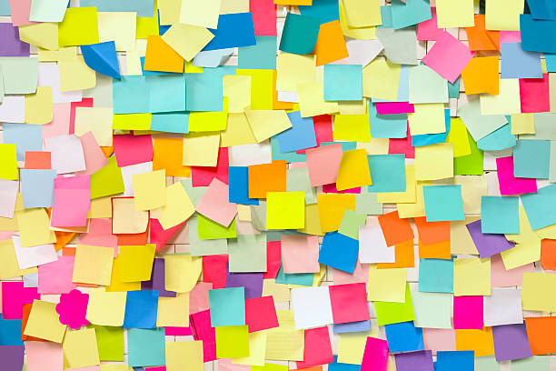 Wall covered with adhesive note papers Wall covered with blank adhesive note papers large group of objects stock pictures, royalty-free photos & images
