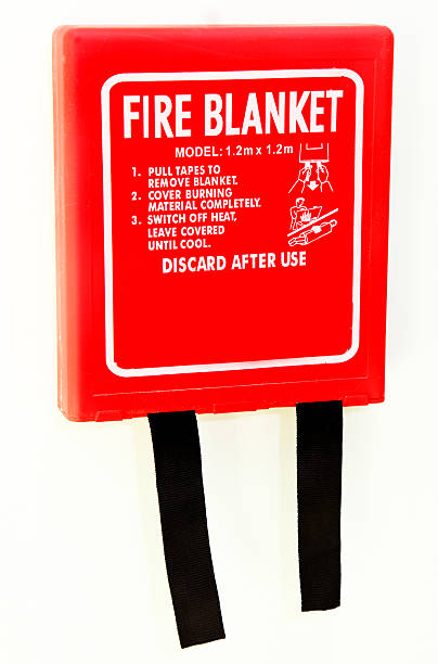 wall mounted fire blanket stock photo