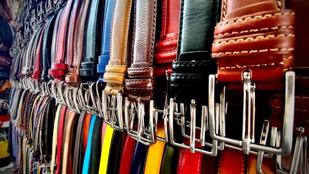 wall-to-wall leather belts in every color - one leather vendor’s stall at the mercato centrale firenze stock photo