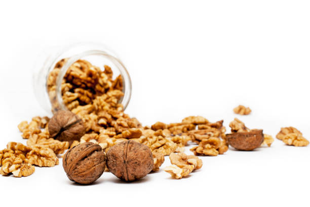 Walnuts with jar in the background stock photo