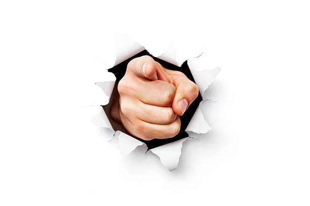 I want you finger coming through torn paper I want you finger coming throgh torn paper.Please note: Clipping path is included in this file (only XXXL version) pointing stock pictures, royalty-free photos & images
