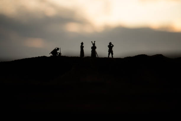 War concept. Creative composition. Silhouette of German general at the desert. Army commanders watching to the battle. War concept. Creative composition. Silhouette of German general at the desert. Army commanders watching to the battle. Military fighting silhouettes on sunset marshall photos stock pictures, royalty-free photos & images