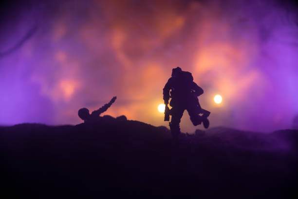 War Concept. Military silhouettes fighting scene on war fog sky background, World War Soldiers Silhouette Below Cloudy Skyline At night. Battle in ruined city. Selective focus stock photo