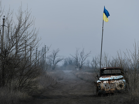War in Eastern Ukraine, Donbas,  frontline positions near the town Avdiivka in Donetsk region - mud road between minefields  by military position 'Butovka'