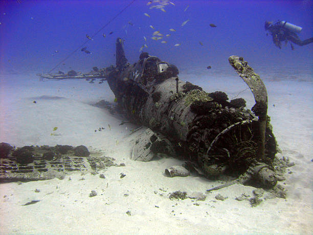 War plane of the Deep Popular dive site on the east side of Oahu.   ww2 american fighter planes pictures stock pictures, royalty-free photos & images