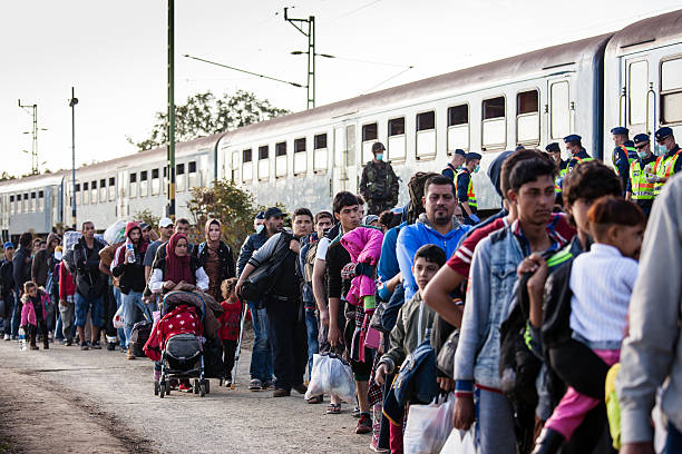 War refugees at Zakany Railway Station Zakany, Hungary - October 5, 2015: War refugees at Zakany Railway Station, Refugees are arriving constantly to Hungary on the way to Germany. 5 Octoberber 2015 in Zakany, Hungary. 2015 stock pictures, royalty-free photos & images