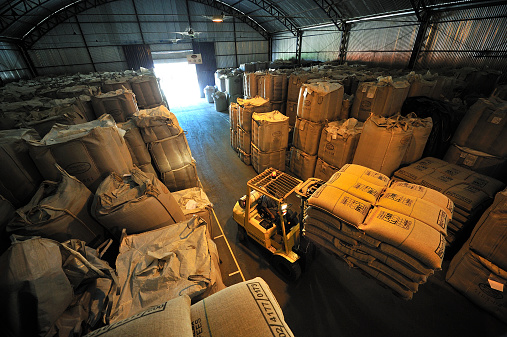 Alfenas, Minas, Gerais, Brazil - September 19, 2011: Warehouse of bags full of coffee at coffee plantation in Alfenas, the southern part of Minas Gerais state, the center of coffee production in Brazil.