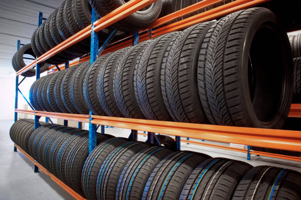 Warehouse with tyres on store warehouse storing car tyres in rows for sale tire vehicle part stock pictures, royalty-free photos & images