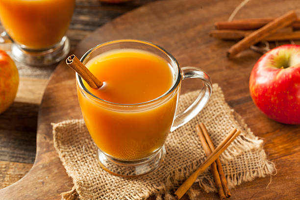 Warm Hot Apple Cider Warm Hot Apple Cider Ready to Drink in Autumn cider stock pictures, royalty-free photos & images