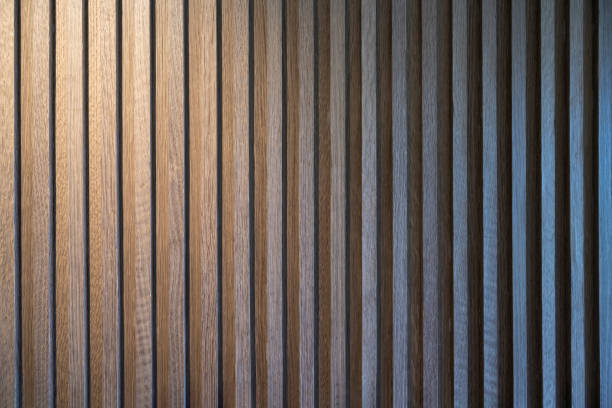 Warm light illuminates regular and neat wooden lines stock photo