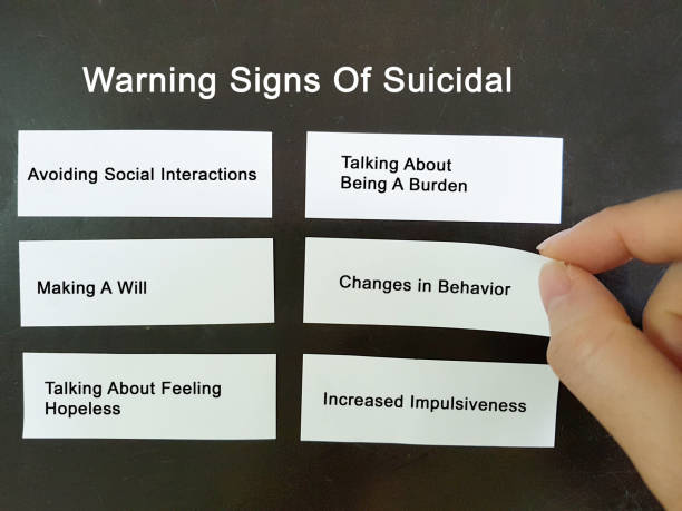 Warning signs of suicidal. Suicide prevention and awareness stock photo