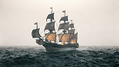 istock Warship Sailing The Sea During A Storm 1306702763