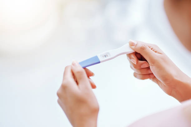 I was hoping for that! Cropped shot of a young woman taking a pregnancy test positive pregnancy test stock pictures, royalty-free photos & images