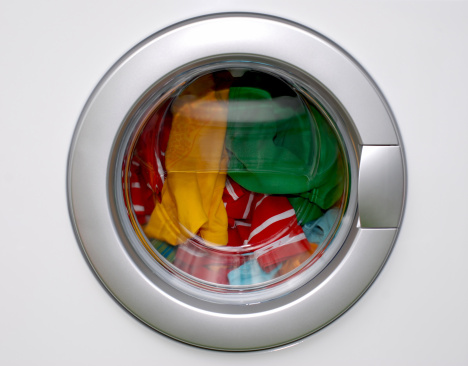 washing machine - filled with colorful laundry
