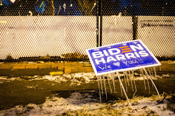 Washington, DC, USA - Feb. 14, 2020: Biden Harris elections sign frozen in front of the fence surrounding White house stock photo