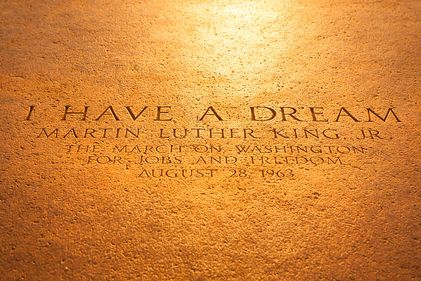 Washington Monument from the Lincoln Memorial Washington D.C., USA - September 23, 2012: Martin Luther King quote inscription on the steps of the Lincoln Memorial on The National Mall.  "I Have a Dream" was a public speech delivered by American civil rights activist Martin Luther King Jr. on August 28, 1963, in which he calls for an end to racism in the United States. Delivered to over 250,000 civil rights supporters from the steps of the Lincoln Memorial during the March on Washington, the speech was a defining moment of the American Civil Rights Movement. martin luther king jr photos stock pictures, royalty-free photos & images
