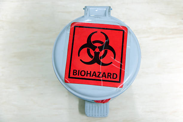 waste bin with biohazard sign stock photo