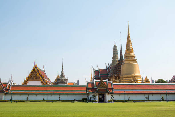 Wat Phra Kaew, Bangkok famous landmark of Thailand, Temple of the Emerald Buddha with blue sky. stock photo