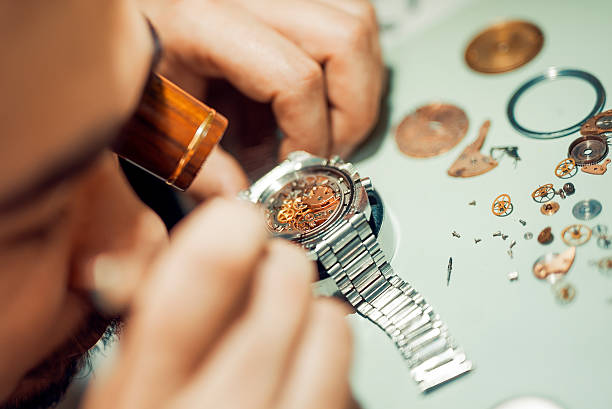 Watchmaker at work stock photo