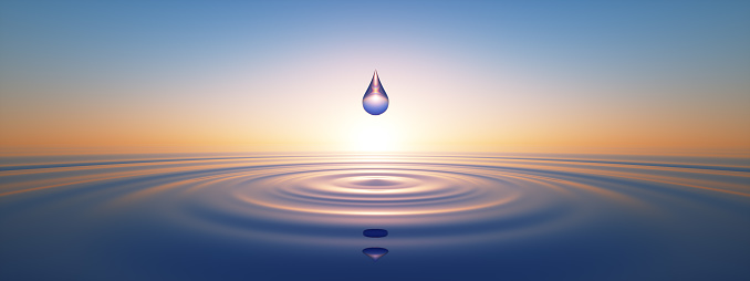 Water Drop in wide calm Ocean with ripples at sunset