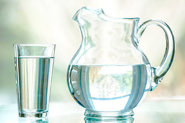 Water Pitcher and Glass stock photo