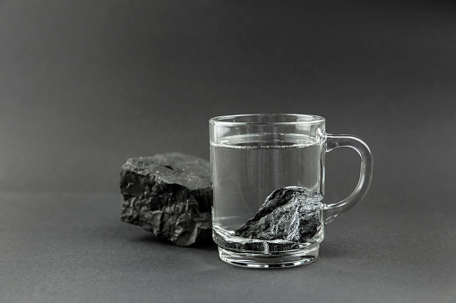 water-purification-with-black-shungite-stones-clear-drinking-glass-picture-id1136893146?b=1&k=20&m=1136893146&s=170667a&w=0&h=9yErOY2ztRMYLQR0uUKu-E7YVPMsl2UMa00U5mVYPg8=
