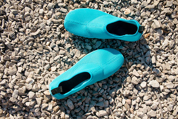 water shoes on the beach stock photo