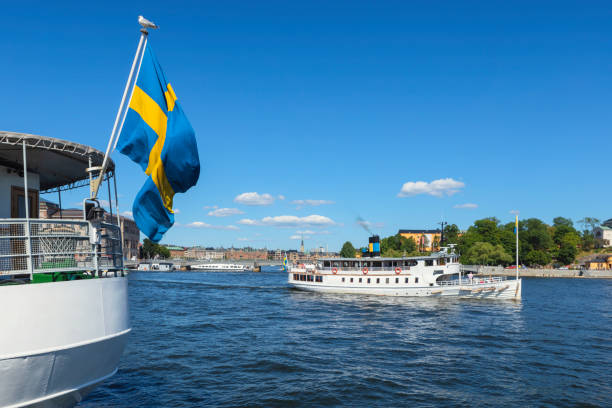 Water tour in Stockholm A tourboat on its way from central Stockholm towards the Stockholm archipelago. swedish flag photos stock pictures, royalty-free photos & images