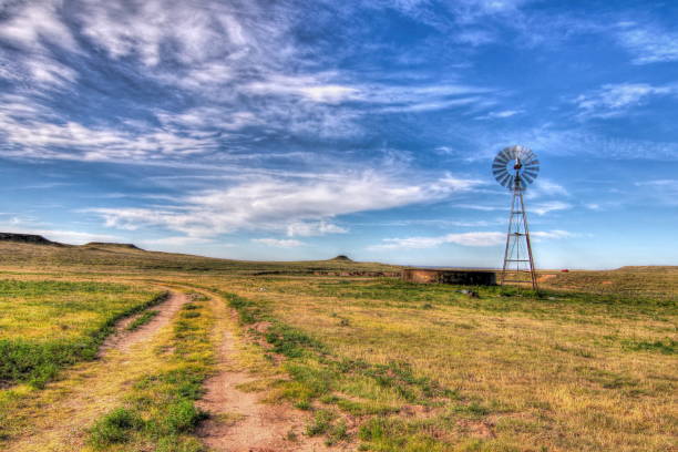 Water well and Windmill on the Texas Plains A windmill pumps water from a well in the Texas Panhandle plains amarillo texas stock pictures, royalty-free photos & images