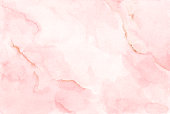 istock Watercolor background texture soft pink and gold. 1305064855