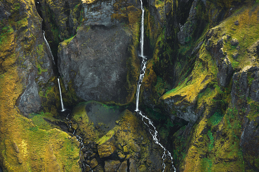 Aerial view on majestic waterfalls near Thorsmork in South Iceland.