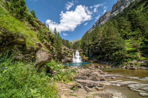 Waterfalls of the river Ara in the Ordesa valley on a sunny day. stock photo