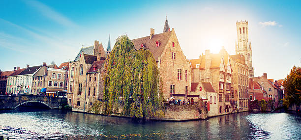 Waterfront Buildings in Bruges, Belgium Panoramic view to the canals of Bruges brugge belgium stock pictures, royalty-free photos & images