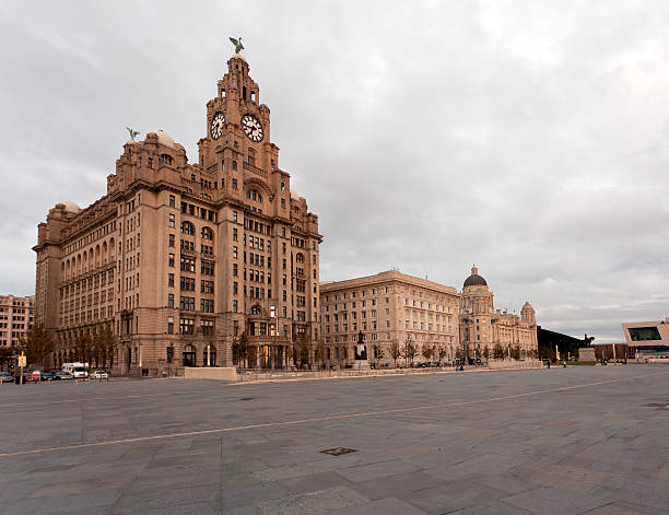 Waterfront in Liverpool Three Graces and Liver building on waterfront in Liverpool, England river mersey liverpool stock pictures, royalty-free photos & images