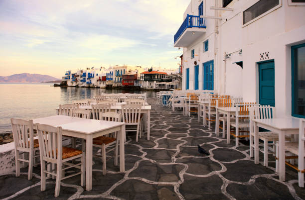 Waterfront tables, Mikonos Island, Greece stock photo