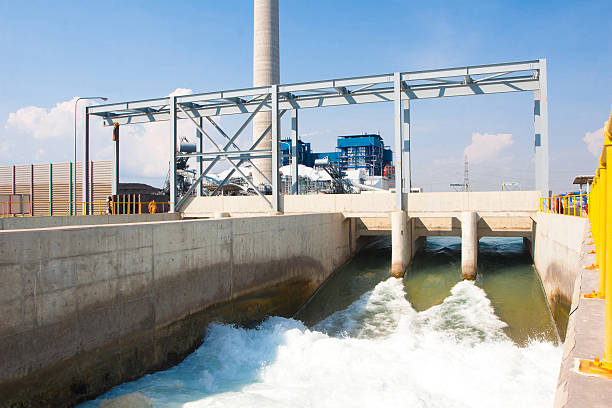 Watergate draining clean water to river after wastewater treatment stock photo