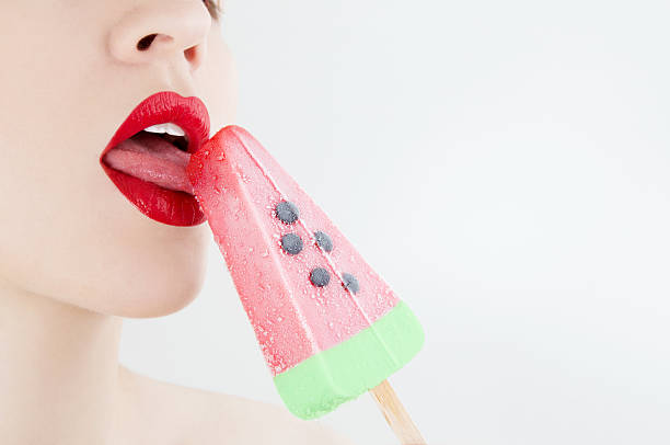 watermelon ice-cream - woman licking stock photos and pictures.