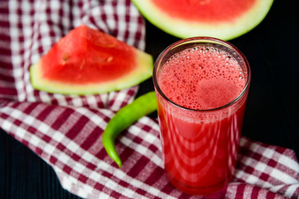 Watermelon juice and watermelon slice Watermelon juice with chilly and ginger.It add little spicy to watermelon juice. watermelon juice stock pictures, royalty-free photos & images